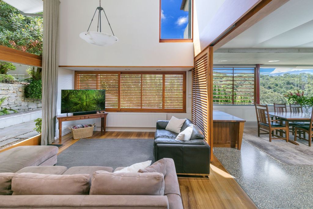 The arrival of green from nature in a living room with black and white tones relieves industrial stress. In a different corner, a basic, rustic bookcase is used to display gathered artifacts ranging from flower vases to rare statues. The cushions are also modified in a playful but delicate manner, making them acceptable for different rooms in the country.