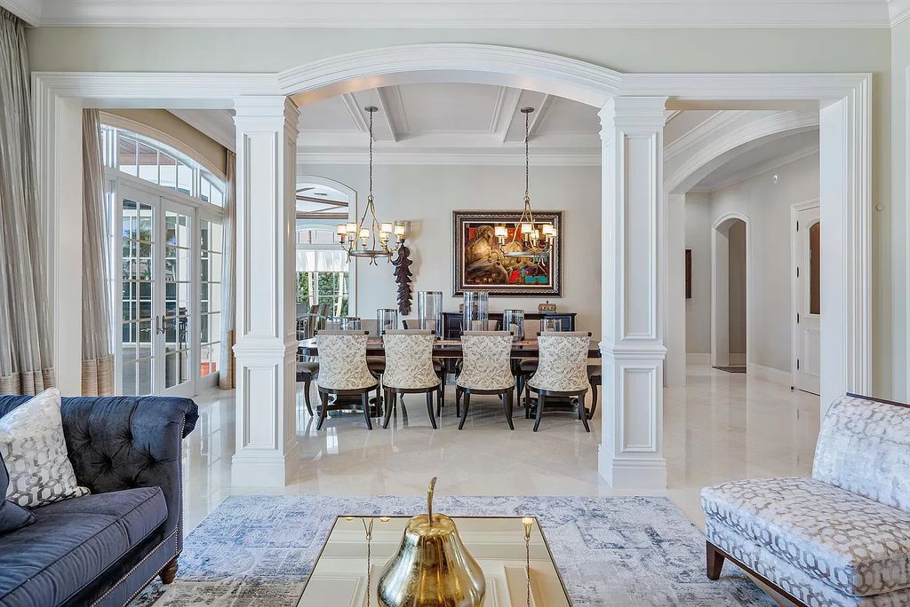 The Boca Raton Home is a luxurious estate with fine custom details and one of a kind finishes featuring the most serene waterfront views now available for sale. This home located at 230 S Maya Palm Dr, Boca Raton, Florida; offering 5 bedrooms and 8 bathrooms with over 7,000 square feet of living spaces.