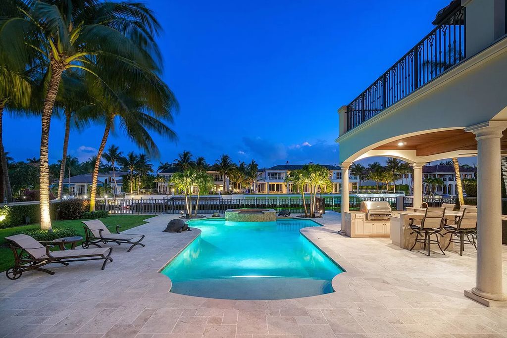 The Boca Raton Home is a luxurious estate with fine custom details and one of a kind finishes featuring the most serene waterfront views now available for sale. This home located at 230 S Maya Palm Dr, Boca Raton, Florida; offering 5 bedrooms and 8 bathrooms with over 7,000 square feet of living spaces.