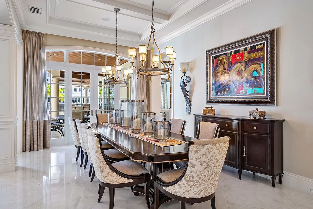 The Boca Raton Home is a luxurious estate with fine custom details and one of a kind finishes featuring the most serene waterfront views now available for sale. This home located at 230 S Maya Palm Dr, Boca Raton, Florida; offering 5 bedrooms and 8 bathrooms with over 7,000 square feet of living spaces.