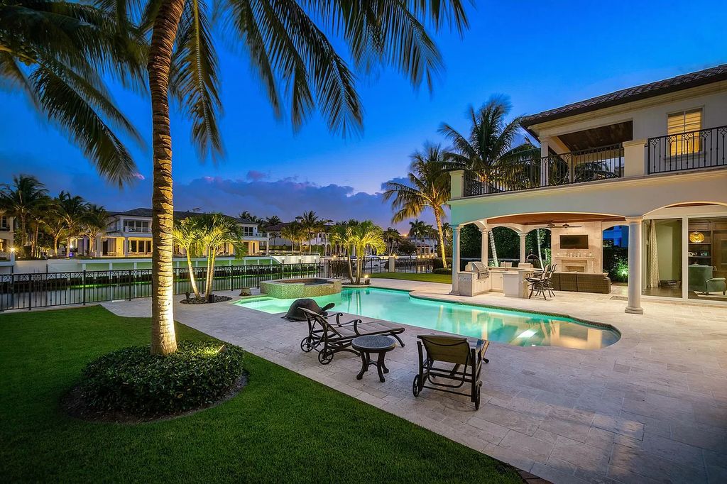 The Boca Raton Home is a luxurious estate with fine custom details and one of a kind finishes featuring the most serene waterfront views now available for sale. This home located at 230 S Maya Palm Dr, Boca Raton, Florida; offering 5 bedrooms and 8 bathrooms with over 7,000 square feet of living spaces.