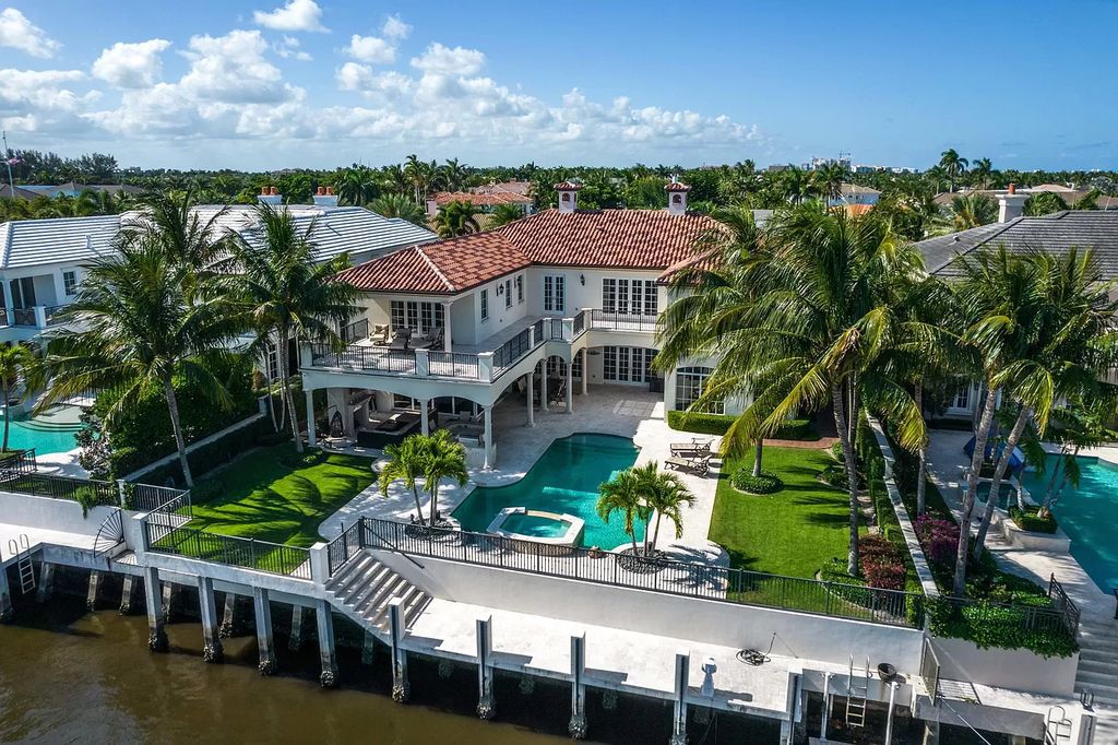 The Boca Raton Home is a luxurious estate with fine custom details and one of a kind finishes featuring the most serene waterfront views now available for sale. This home located at 230 S Maya Palm Dr, Boca Raton, Florida; offering 5 bedrooms and 8 bathrooms with over 7,000 square feet of living spaces.