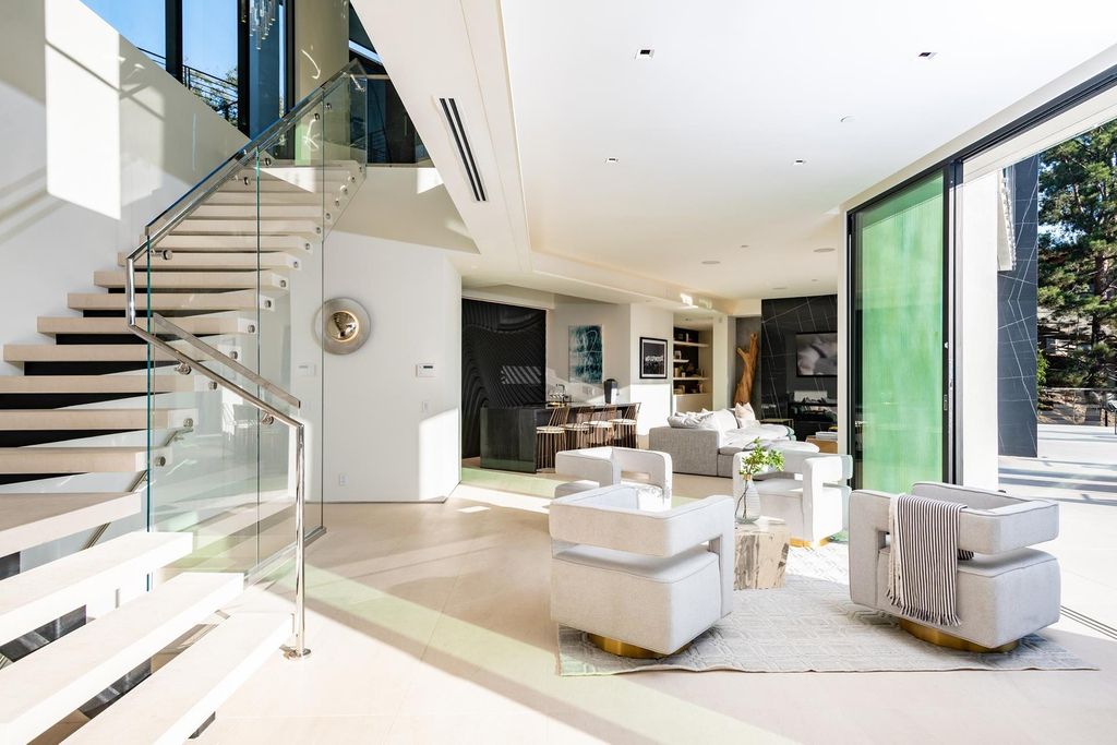 The Bel Air Home is an immaculately designed contemporary masterpiece with explosive canyon, ocean, and city views now available for sale. This home located at 1037 Stradella Rd, Los Angeles, California