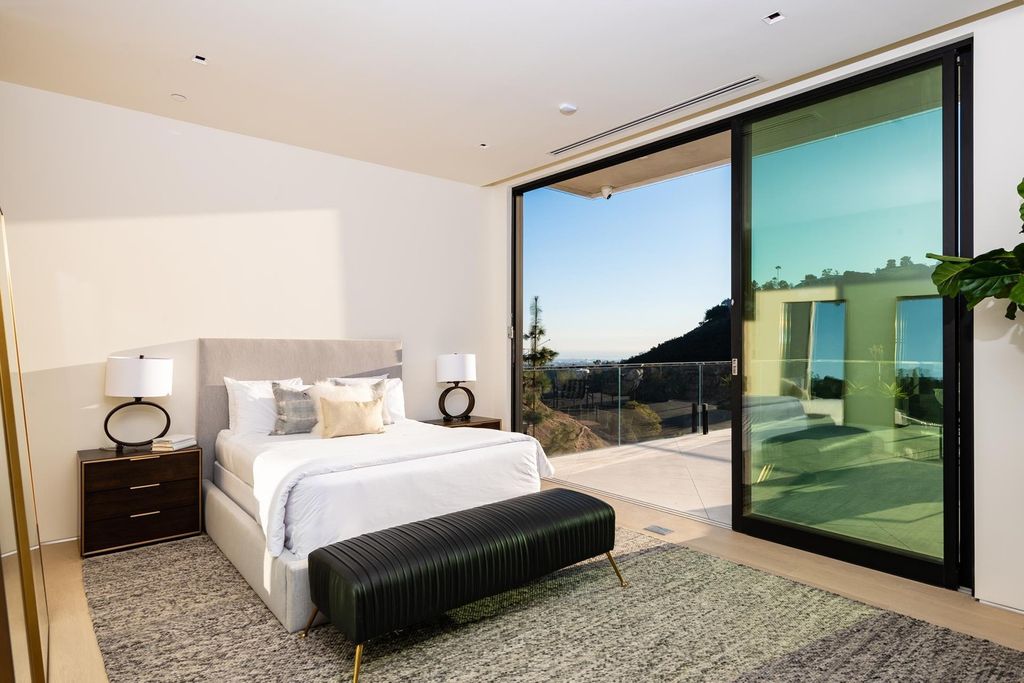 The Bel Air Home is an immaculately designed contemporary masterpiece with explosive canyon, ocean, and city views now available for sale. This home located at 1037 Stradella Rd, Los Angeles, California