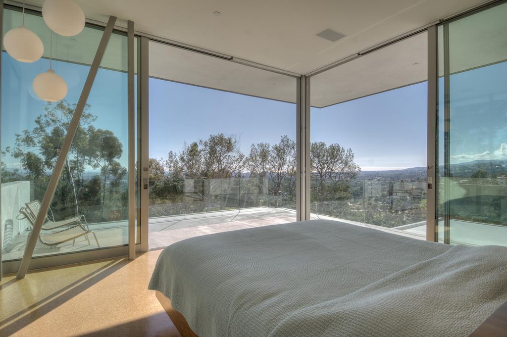 The Beverly Hills Home set atop a promontory with total privacy & unobstructed views from downtown to the ocean now available for sale. This home located at 1133 Miradero Rd, Beverly Hills, California