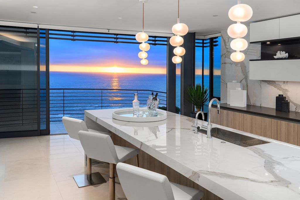 The Laguna Beach Home is a newly constructed residence set on a stunning bluff-top promontory overlooking Thousand Steps Cove now available for sale. This home located at 56 N La Senda Dr, Laguna Beach, California