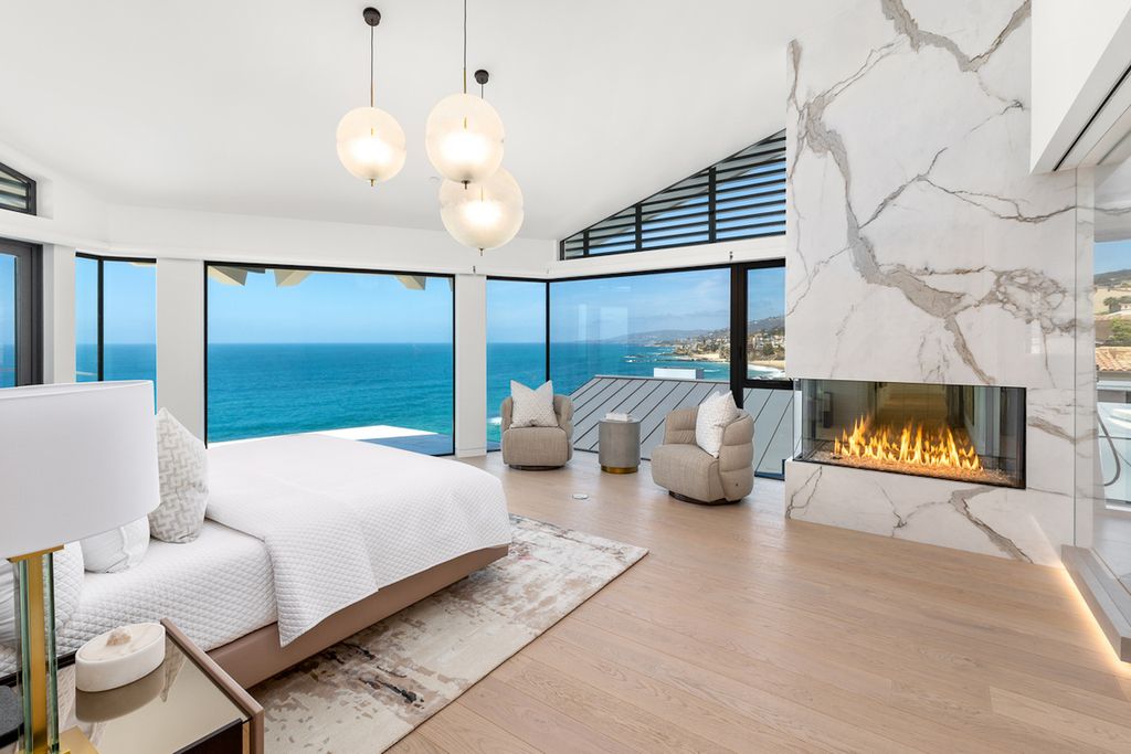 The Laguna Beach Home is a newly constructed residence set on a stunning bluff-top promontory overlooking Thousand Steps Cove now available for sale. This home located at 56 N La Senda Dr, Laguna Beach, California