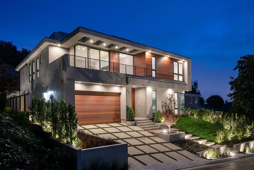 The Modern Home in Los Angeles is an exquisite warn new construction residence offers an array of earthy elements now available for sale. This home located at 5554 Green Oak Dr, Los Angeles, California