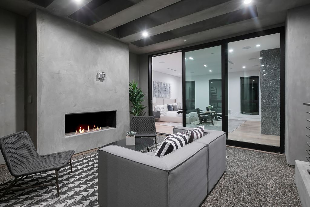 The Modern Home in Los Angeles is an exquisite warn new construction residence offers an array of earthy elements now available for sale. This home located at 5554 Green Oak Dr, Los Angeles, California