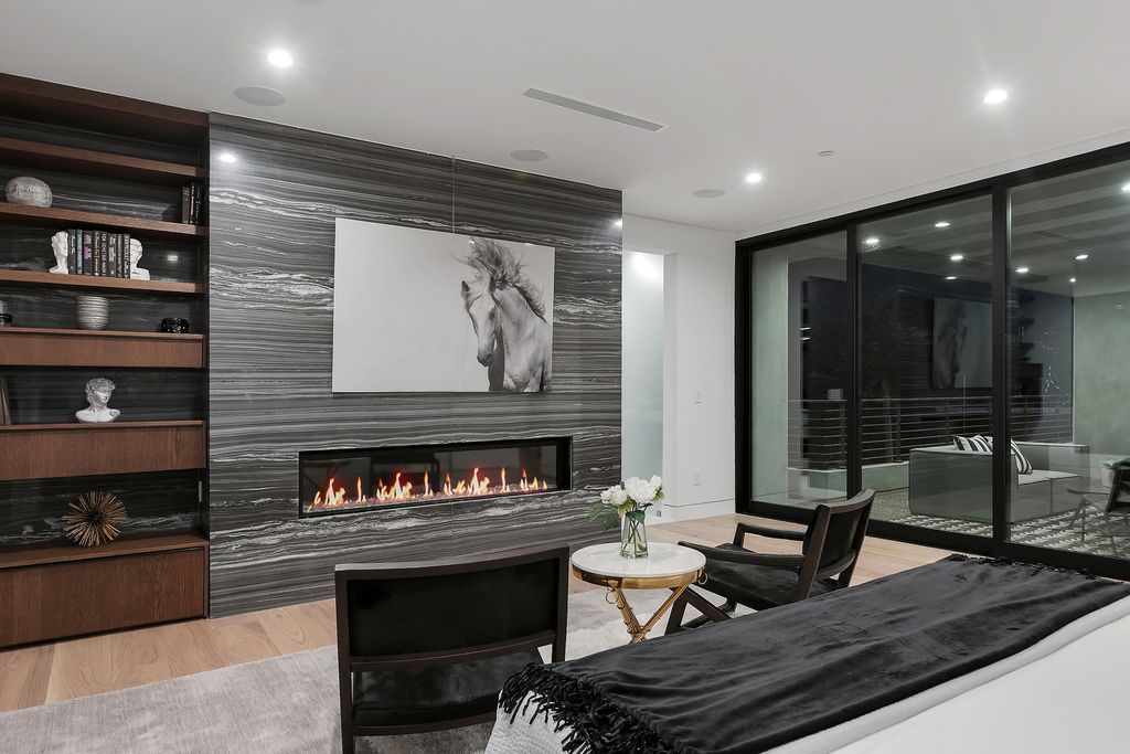 The Modern Home in Los Angeles is an exquisite warn new construction residence offers an array of earthy elements now available for sale. This home located at 5554 Green Oak Dr, Los Angeles, California