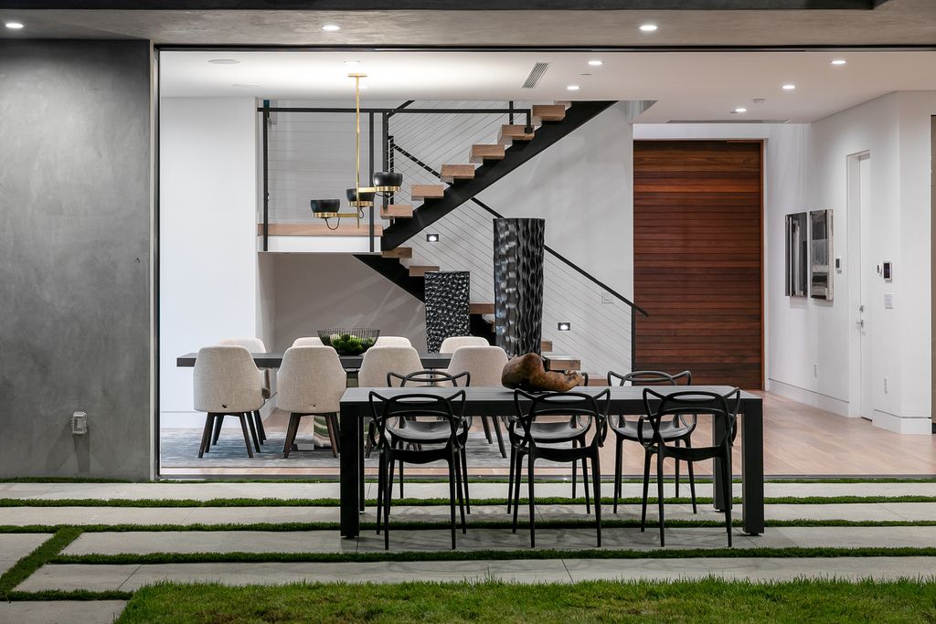 The Modern Home in Los Angeles is an exquisite warn new construction residence offers an array of earthy elements now available for sale. This home located at 5554 Green Oak Dr, Los Angeles, California