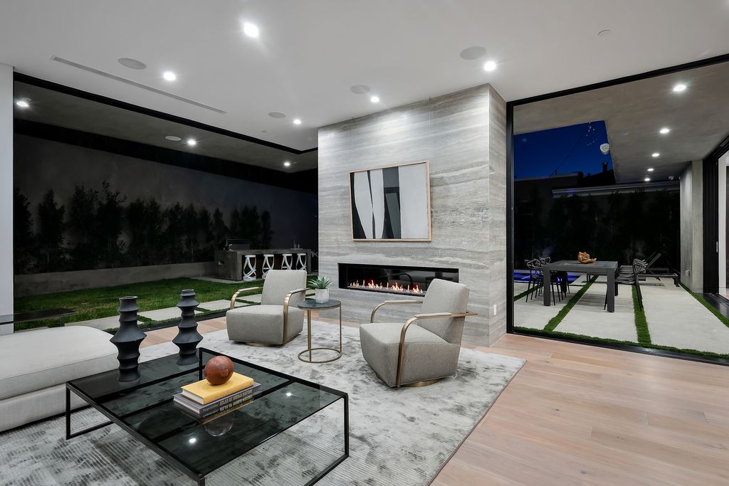 The Modern Home in Los Angeles is an exquisite warn new construction residence offers an array of earthy elements now available for sale. This home located at 5554 Green Oak Dr, Los Angeles, California