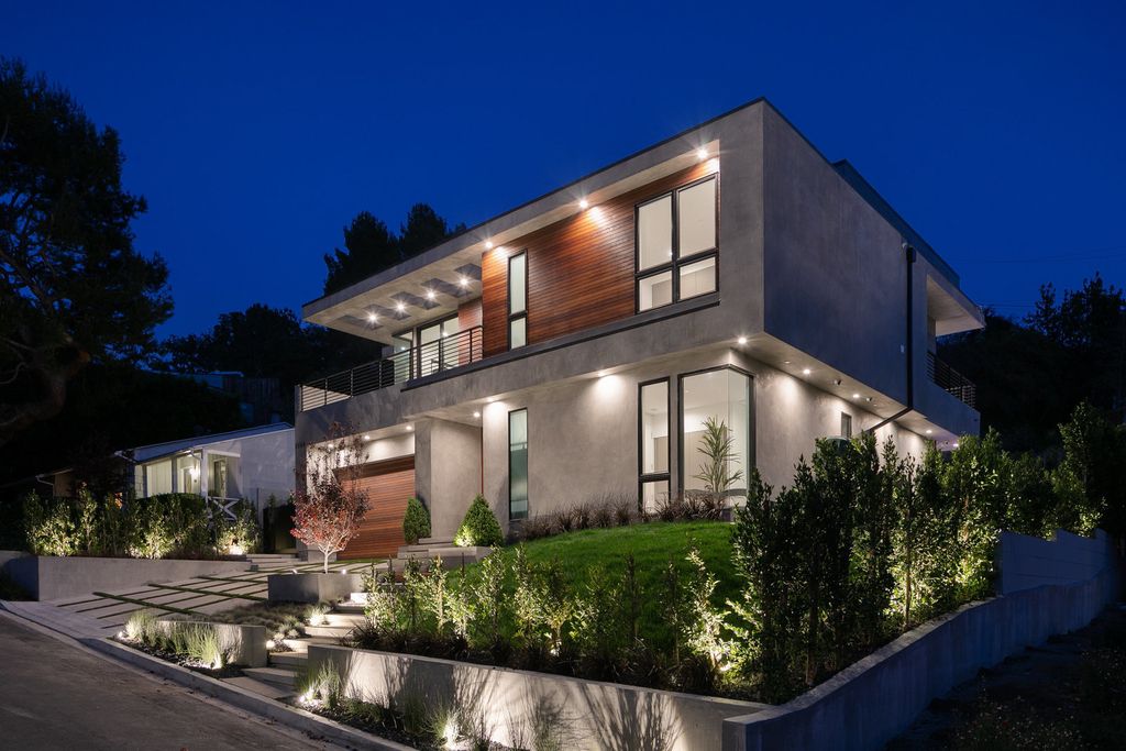 The Modern Home in Los Angeles is an exquisite warn new construction residence offers an array of earthy elements now available for sale. This home located at 5554 Green Oak Dr, Los Angeles, California