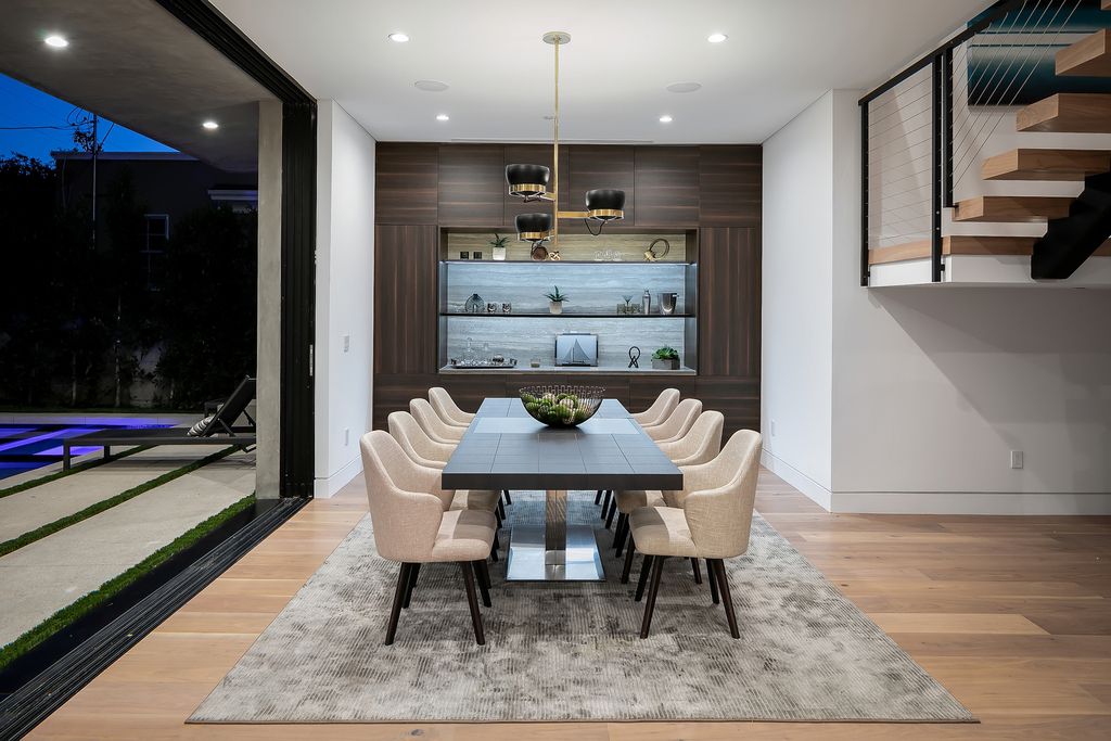 The Modern Home in Los Angeles is an exquisite warn new construction residence offers an array of earthy elements now available for sale. This home located at 5554 Green Oak Dr, Los Angeles, California