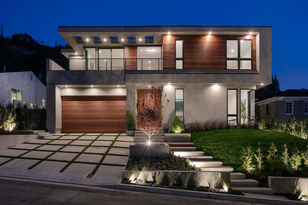 The Modern Home in Los Angeles is an exquisite warn new construction residence offers an array of earthy elements now available for sale. This home located at 5554 Green Oak Dr, Los Angeles, California