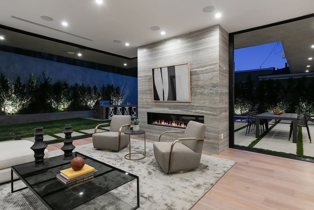 The Modern Home in Los Angeles is an exquisite warn new construction residence offers an array of earthy elements now available for sale. This home located at 5554 Green Oak Dr, Los Angeles, California