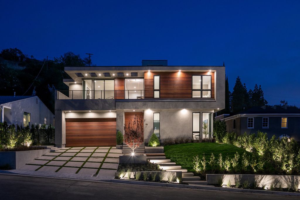 The Modern Home in Los Angeles is an exquisite warn new construction residence offers an array of earthy elements now available for sale. This home located at 5554 Green Oak Dr, Los Angeles, California