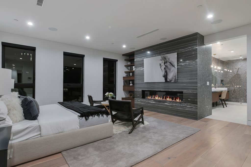 The Modern Home in Los Angeles is an exquisite warn new construction residence offers an array of earthy elements now available for sale. This home located at 5554 Green Oak Dr, Los Angeles, California