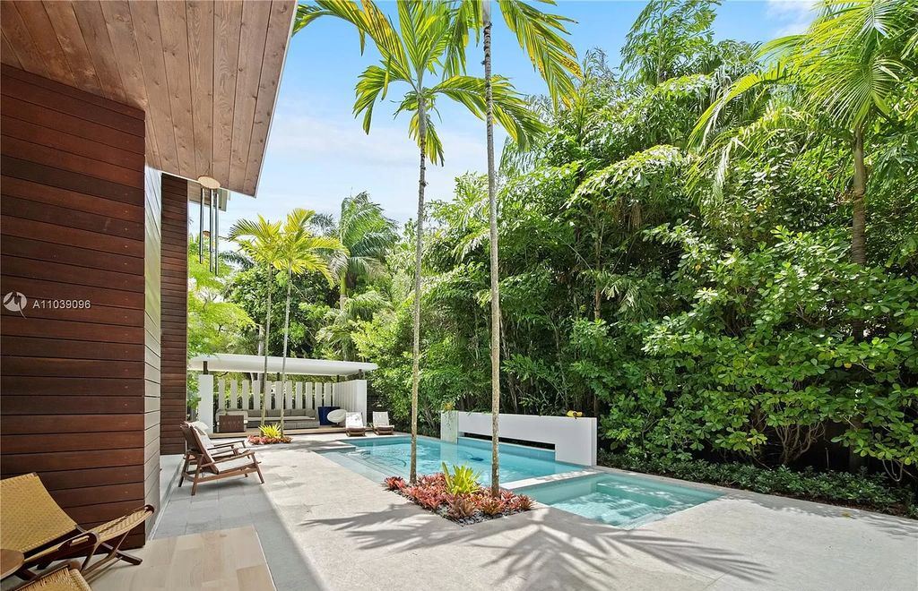 The Home in Miami is a Tropical Modern property located in the heart of Coconut Grove surrounded by lush gardens now available for sale. This home located at 3525 Royal Palm Ave, Miami, Florida