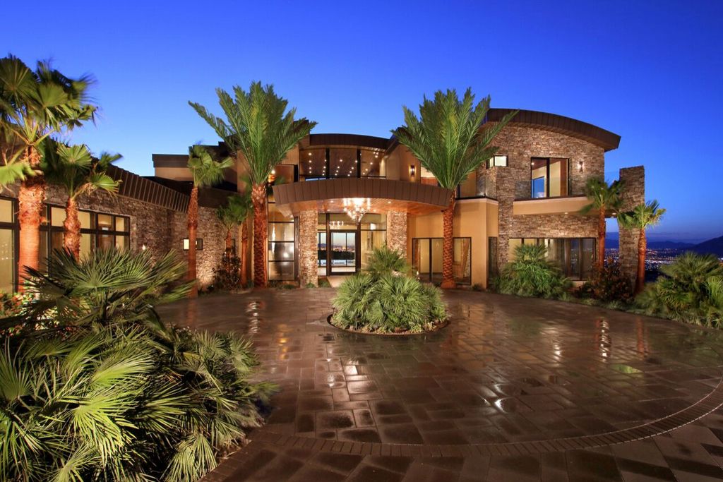 This Unprecedented Luxury Home in Henderson was built by legendary Sun West Custom Homes. Nestled at the top of MacDonald Highlands, this 6 bedrooms, 8 bathrooms character home boasts a warm elegant interior with modern essential features