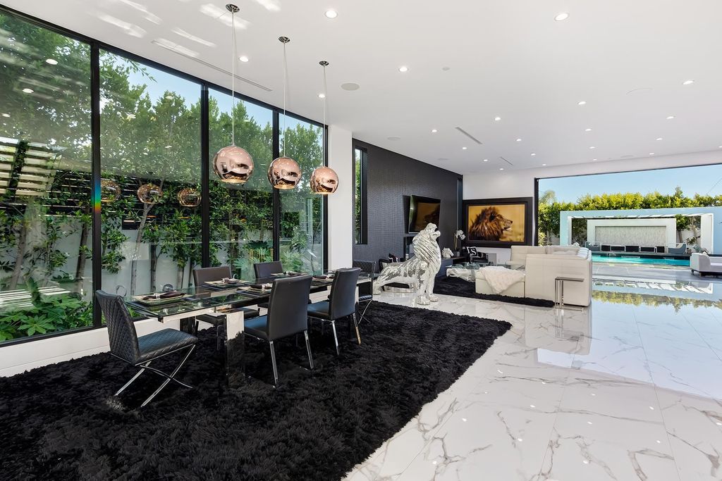 The Resort-like Home in Los Angeles is a sophisticated, high end property in Beverlywood featuring an open floor plan with unobstructed indoor-outdoor flow now available for sale. This home located at 9704 Cashio St, Los Angeles, California