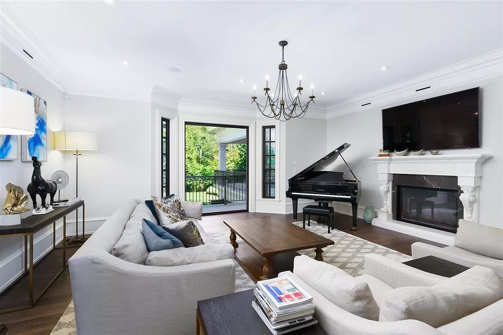 A warm wood piano will instantly make a grand living room cozier because it promotes socializing and overall revelry. Coral, gray, and brass tones work nicely to create a more dynamic yet approachable color narrative in this living room.