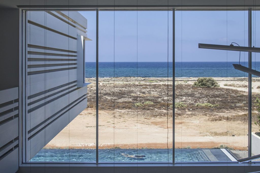 A House by The Sea Features Stripy Aluminium Walls by Pitsou Kedem