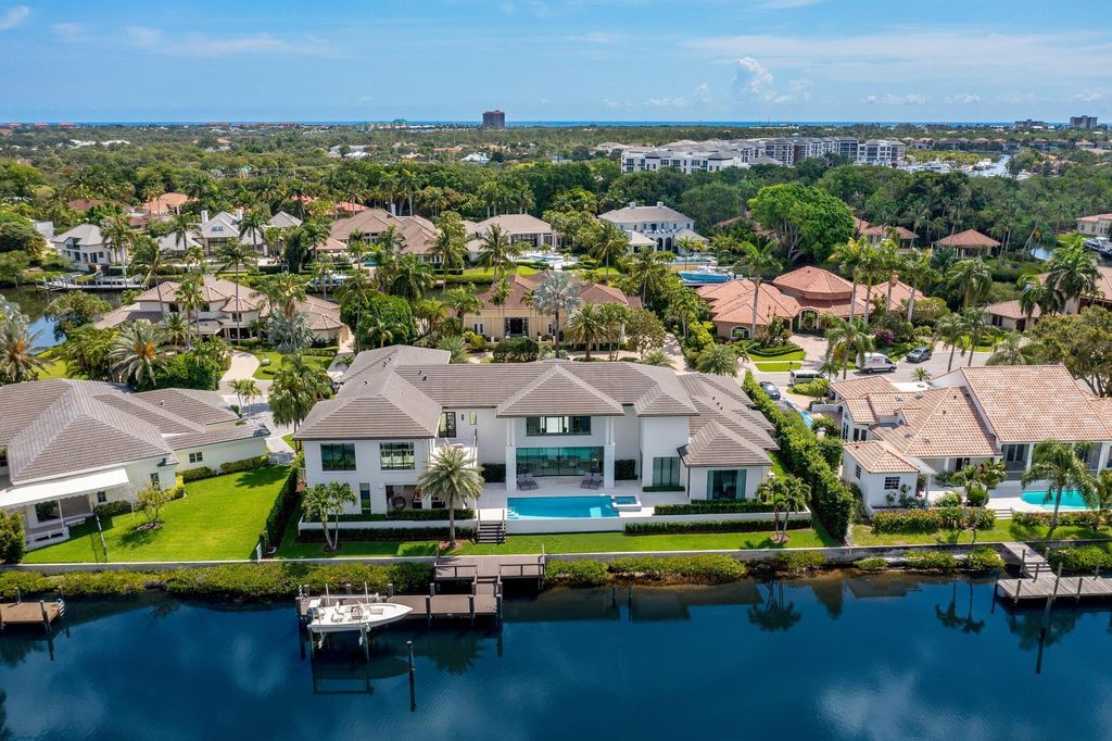 The Home in Palm Beach Gardens is a waterfront contemporary estate located in Frenchman's Creek with 155 feet of deep waterfront now available for sale. This home located at 13843 Le Bateau Isle, Palm Beach Gardens, Florida