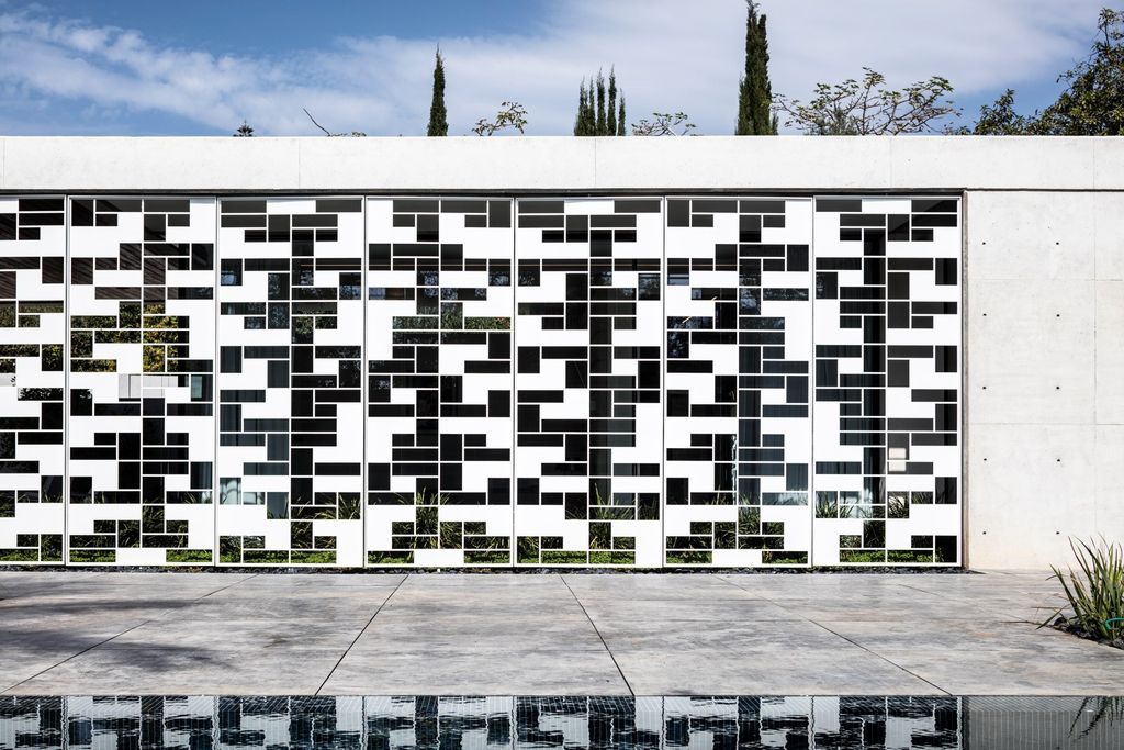 AB House with Grid-like Perforated Screens Features by Pitsou Kedem