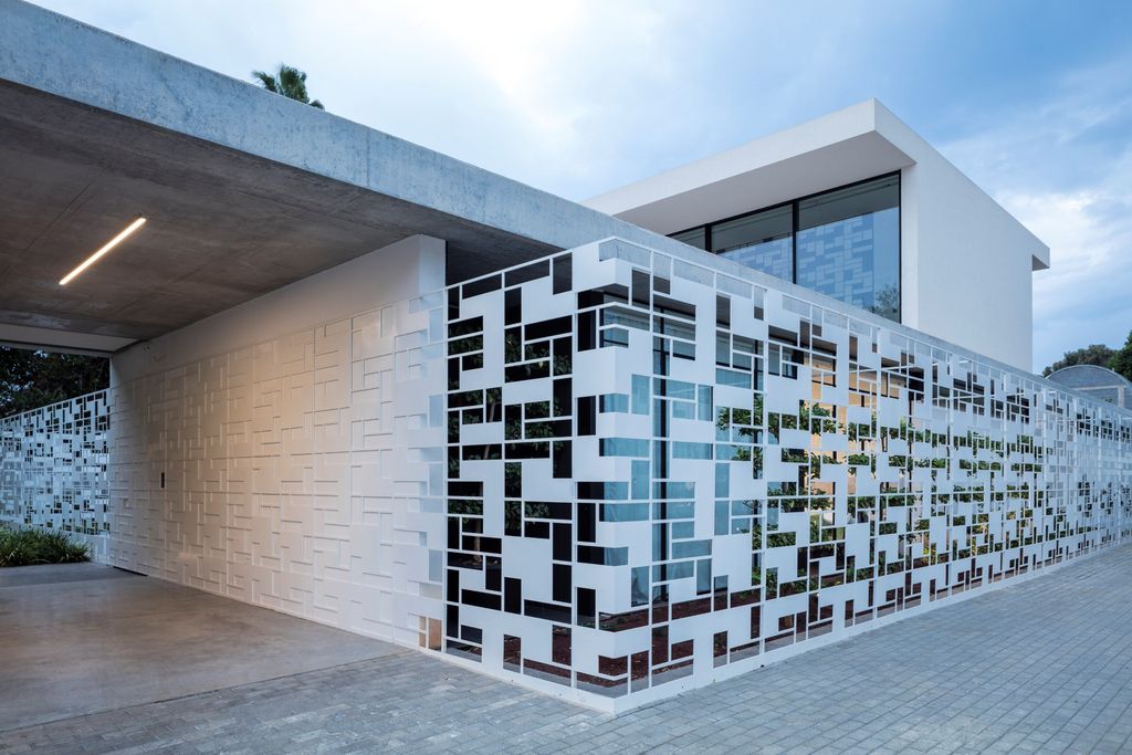 AB House with Grid-like Perforated Screens Features by Pitsou Kedem