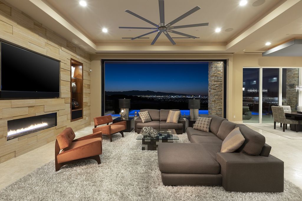 The Home in Henderson is a smart custom estate with sweeping strip, city, golf & mountain views with high quality finishes now available for sale. This home located at 675 Scenic Rim Dr, Henderson, Nevada