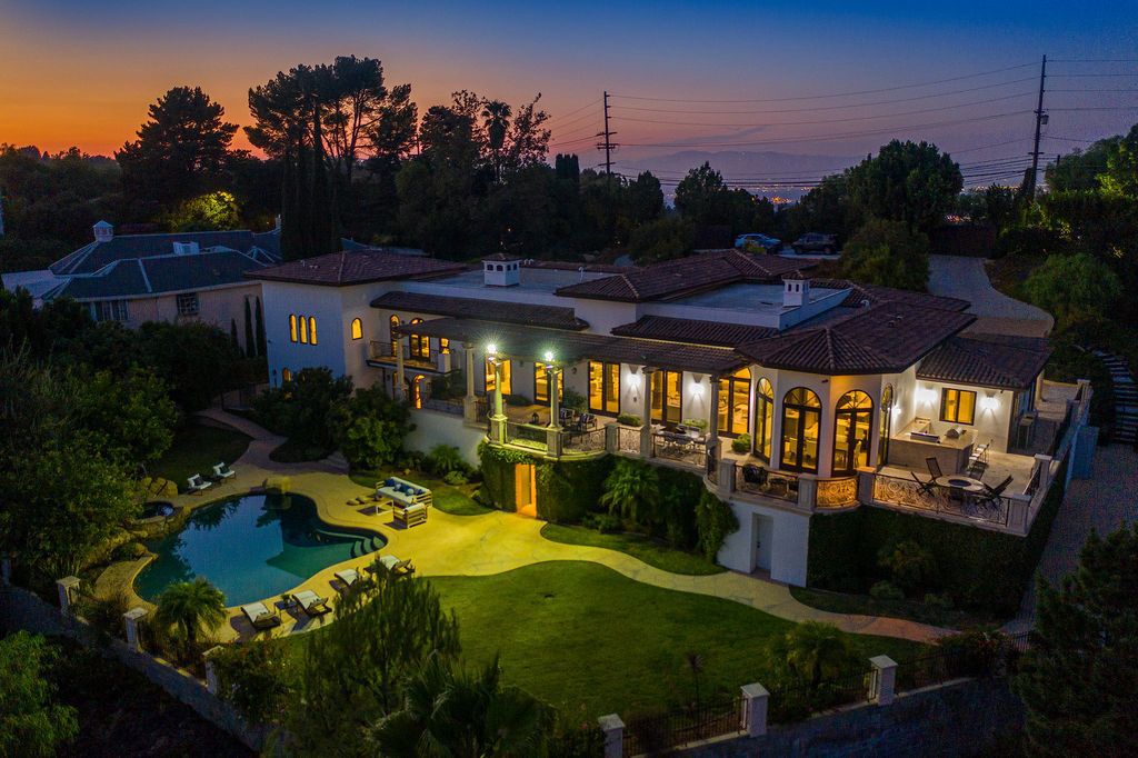 The Spanish Villa in Beverly Hills is an architectural masterpiece on a lush park-like grounds with breathtaking views now available for sale. This home located at 13870 Mulholland Dr, Beverly Hills, California