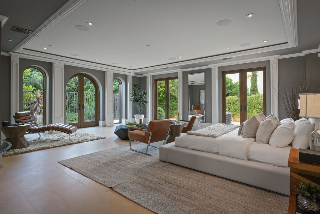 The Spanish Villa in Beverly Hills is an architectural masterpiece on a lush park-like grounds with breathtaking views now available for sale. This home located at 13870 Mulholland Dr, Beverly Hills, California