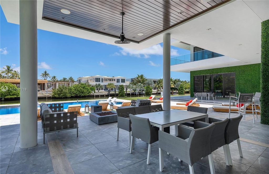 This Mansion in Golden Beach is a modern tropical oasis is situated on a wide canal with breathtaking water views available for sale. This home located at 660 N Island, Golden Beach, Florida