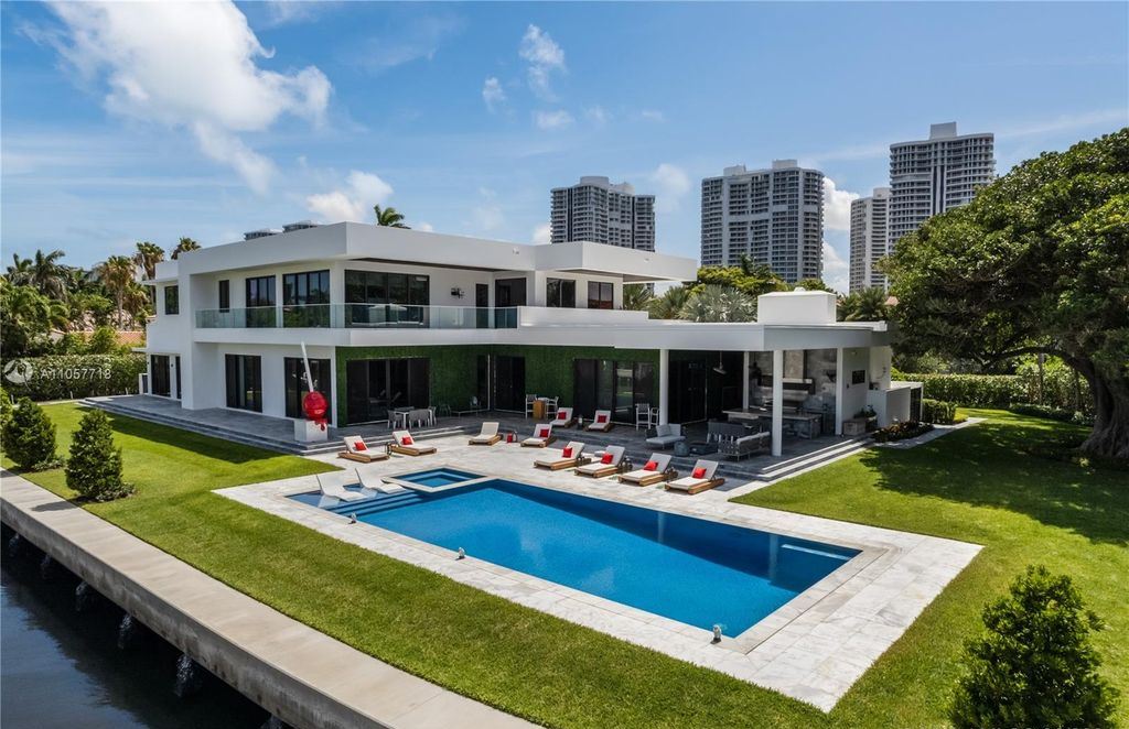 This Mansion in Golden Beach is a modern tropical oasis is situated on a wide canal with breathtaking water views available for sale. This home located at 660 N Island, Golden Beach, Florida