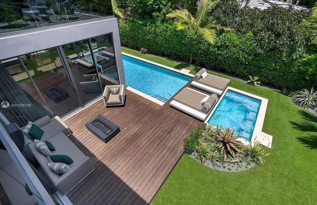 The Home in Miami Beach is a newly built tropical modern property has luxurious living space flawlessly connecting with the exterior now available for sale. This home located at 4535 Nautilus Ct, Miami Beach, Florida