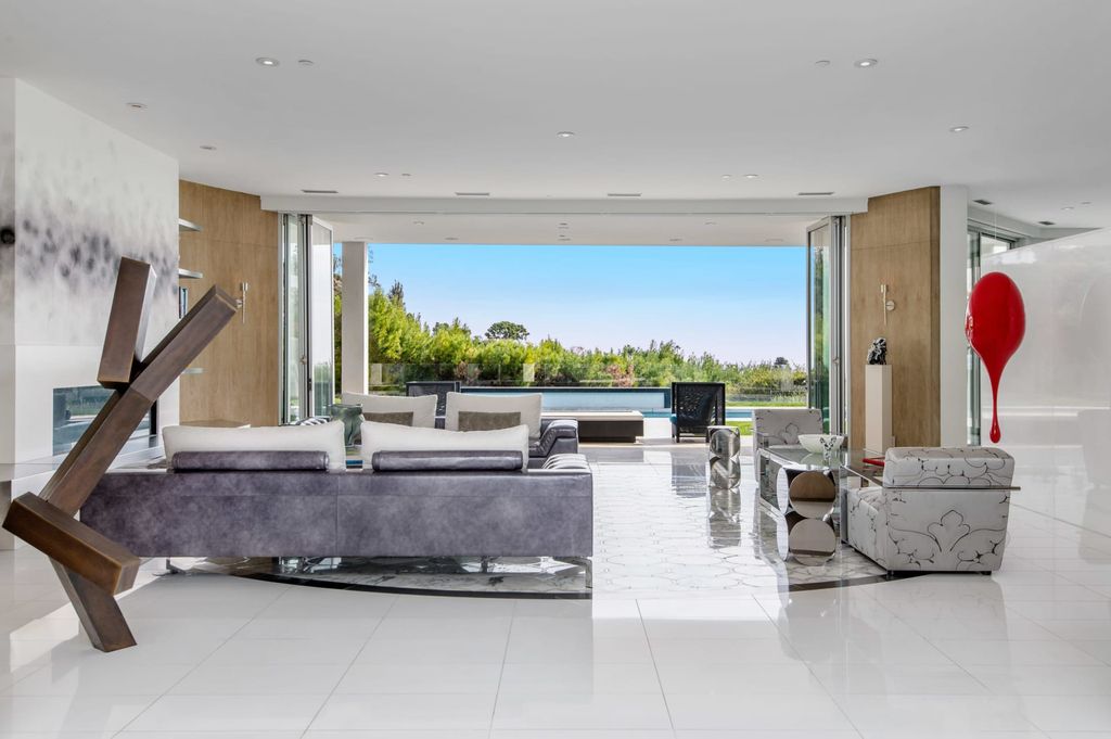The Mid-century Contemporary Home in Beverly Hills situated on a prime city view rim lot in prestigious Trousdale Estates now available for sale. This home located at 1790 Carla Rdg, Beverly Hills, California
