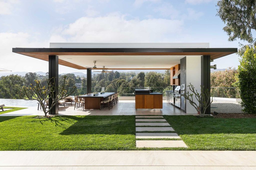 The Contemporary Mansion in Santa Monica is an extraordinary estate with  magnificent fairway and mountain views and exceptional amenities now available for sale. This home located at 1525 San Vicente Blvd, Santa Monica, California