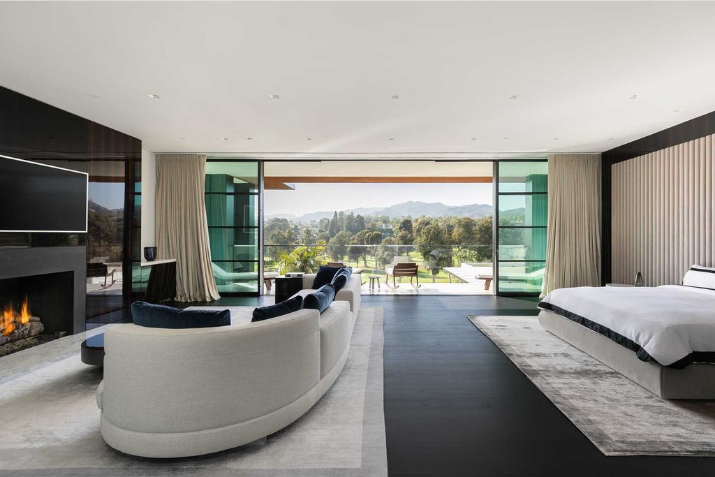 The Contemporary Mansion in Santa Monica is an extraordinary estate with  magnificent fairway and mountain views and exceptional amenities now available for sale. This home located at 1525 San Vicente Blvd, Santa Monica, California