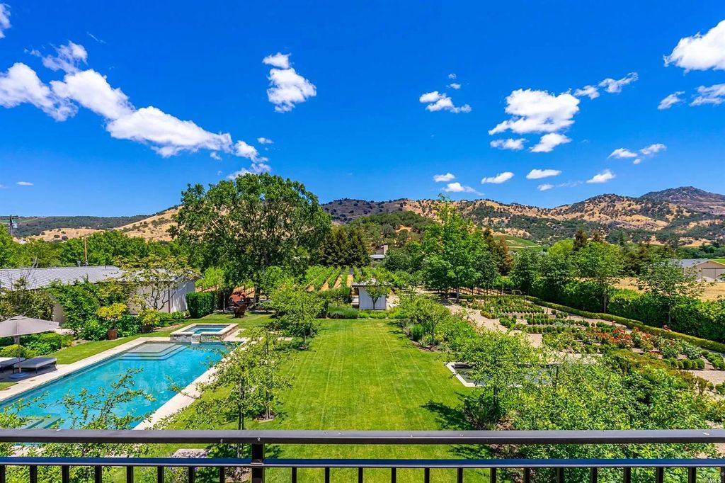 The Home in Napa is a quintessential estate located on a quiet country lane in Yountville and surrounded by vineyards now available for sale. This home located at 1124 State Ln, Yountville, California