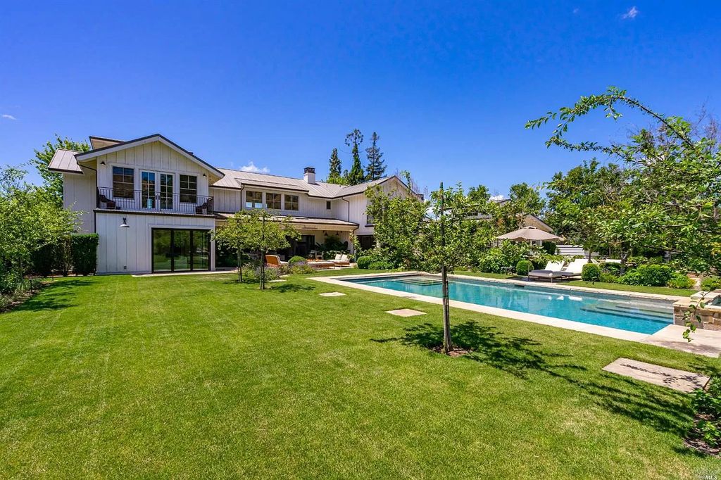 The Home in Napa is a quintessential estate located on a quiet country lane in Yountville and surrounded by vineyards now available for sale. This home located at 1124 State Ln, Yountville, California