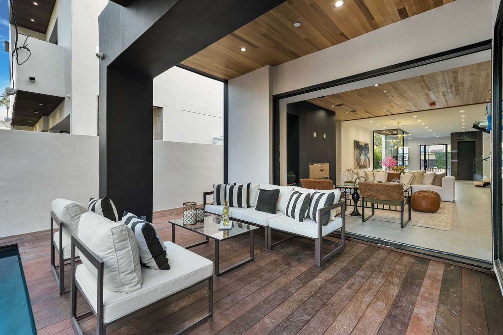 The Los Angeles Home is a gated property in the heart of Melrose Village showcases exquisite contemporary design now available for sale. This home located at 810 N Spaulding Ave, Los Angeles, California