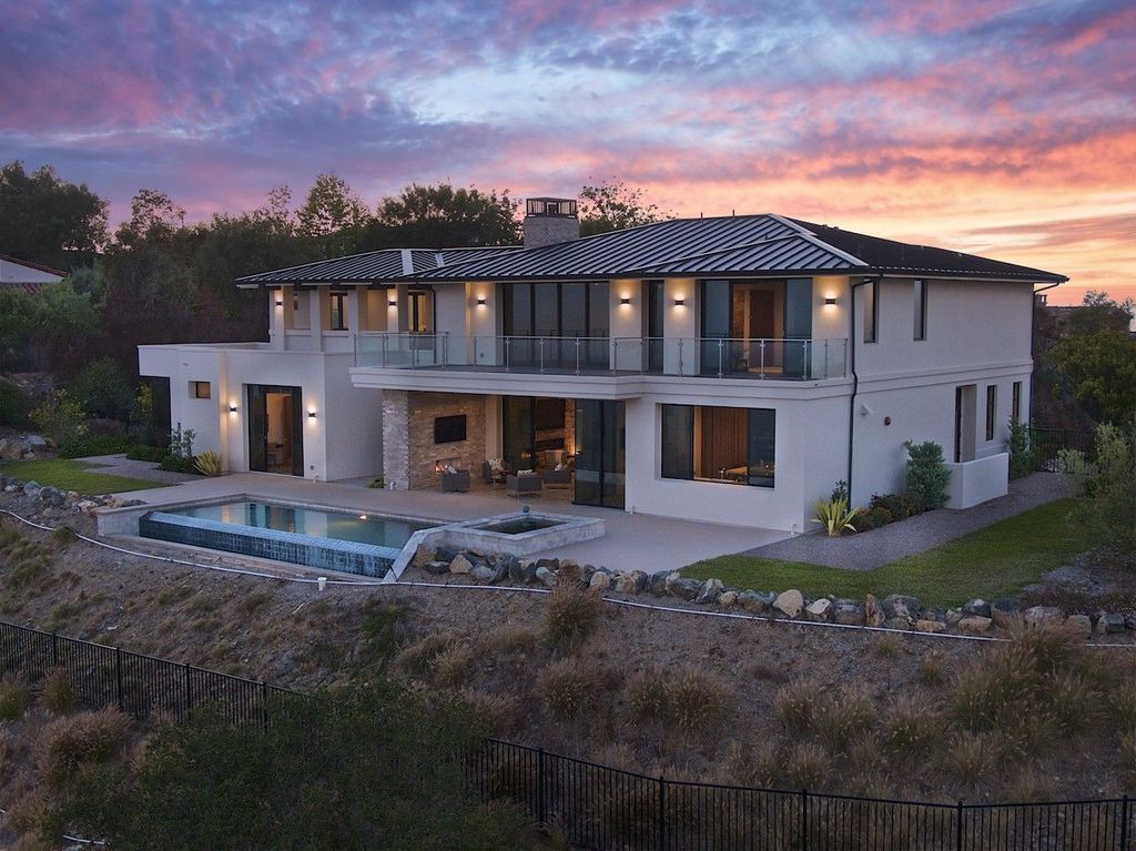 The Home in Rancho Santa Fe is a custom-built, two-story residence in the coveted Cielo community features breathtaking views now available for sale. This home located at 7923 Camino De Arriba, Rancho Santa Fe, California
