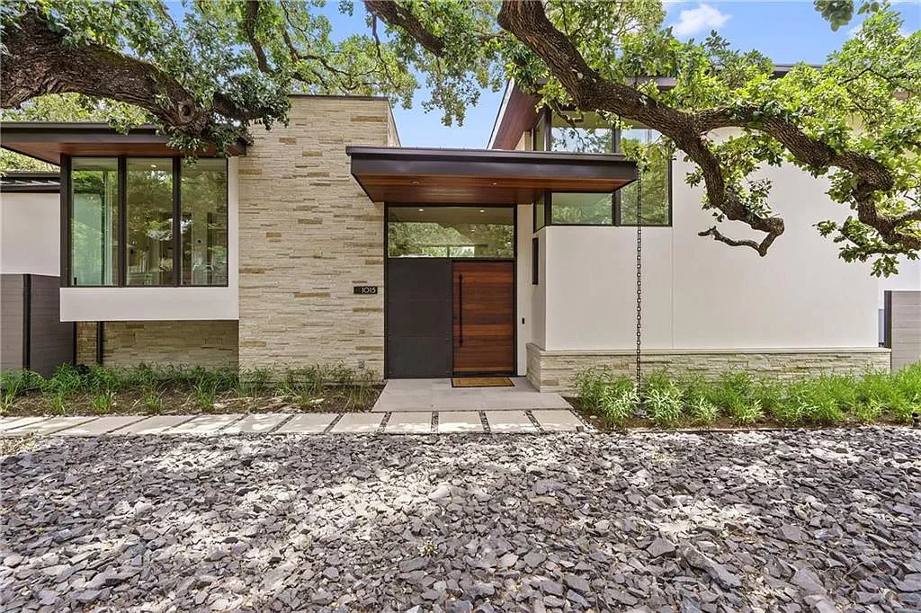 The Austin Home is a contemporary masterpiece in Travis Heights with Lush landscaping and unparalleled privacy now available for sale. This home located at 1015 Bonham Ter, Austin, Texas