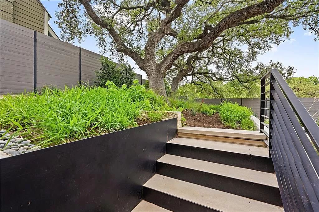 The Austin Home is a contemporary masterpiece in Travis Heights with Lush landscaping and unparalleled privacy now available for sale. This home located at 1015 Bonham Ter, Austin, Texas