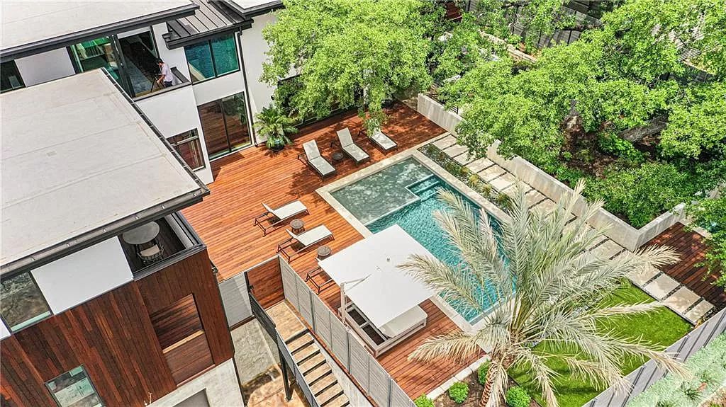 The Austin Home is a contemporary masterpiece in Travis Heights with Lush landscaping and unparalleled privacy now available for sale. This home located at 1015 Bonham Ter, Austin, Texas