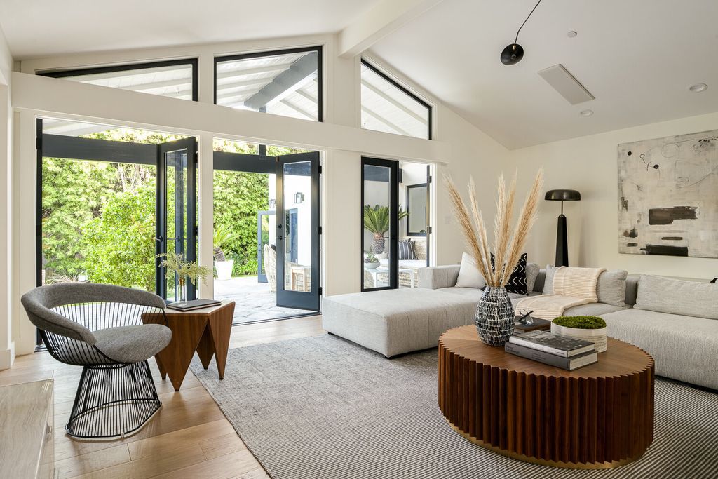 The Contemporary Home in Pacific Palisades is to be captured by the mid-century feeling of the living room that opens up to backyard now available for sale. This home located at 1201 Villa Woods Dr, Pacific Palisades, California
