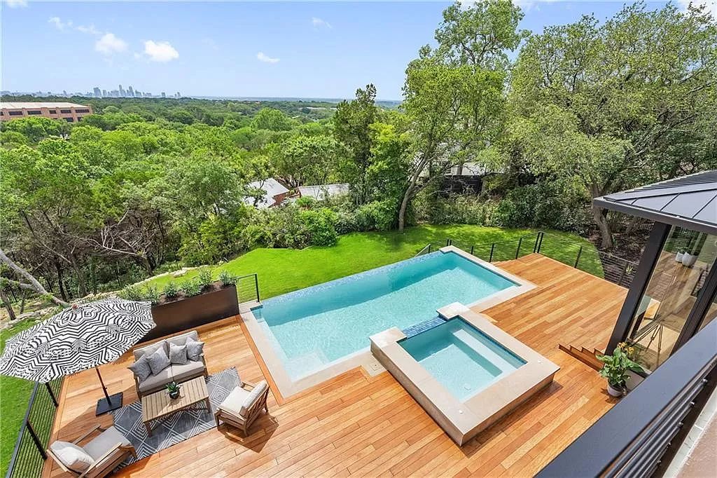 The Austin Home is an undeniably elegant and infinitely liveable estate with panoramic views of downtown Austin now available for sale. This home located at 5 Hillside Ct, Austin, Texas