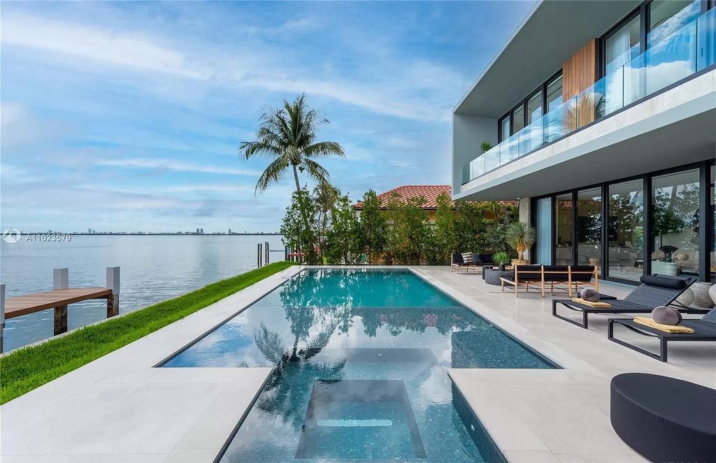The Waterfront Home in Miami Beach is a brand new contemporary estate offers stunning water and Miami Skyline views now available for sale. This home located at 831 N Venetian Dr, Miami Beach, Florida