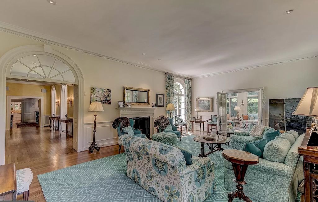 Rugs for living room ideas are occasionally chosen based on the room's color scheme. A coloured rug, on the other hand, can determine the overall feel of a neutral space. The homeowner chose a huge mint green rug to span the entire floor of the room in this pattern. They go very well with the sofa set and the rest of the furnishings in the room. The combination of an open living room space and arched doors creates the illusion of a little garden.